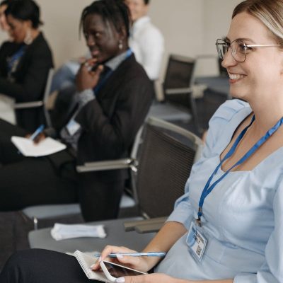 Participants attentively engage in a seminar, showcasing diversity and collaboration.